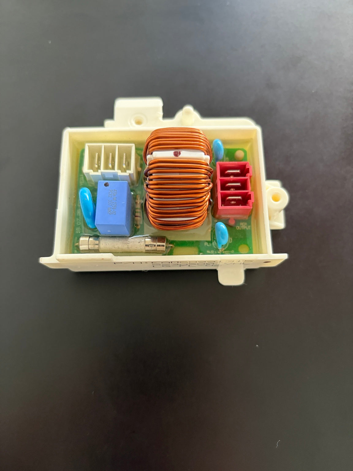 LG EAM60991315 washer noise filter assembly top view